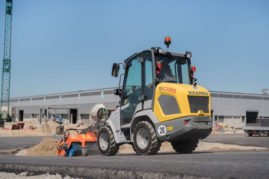 The compact 5035 while brushing a road.