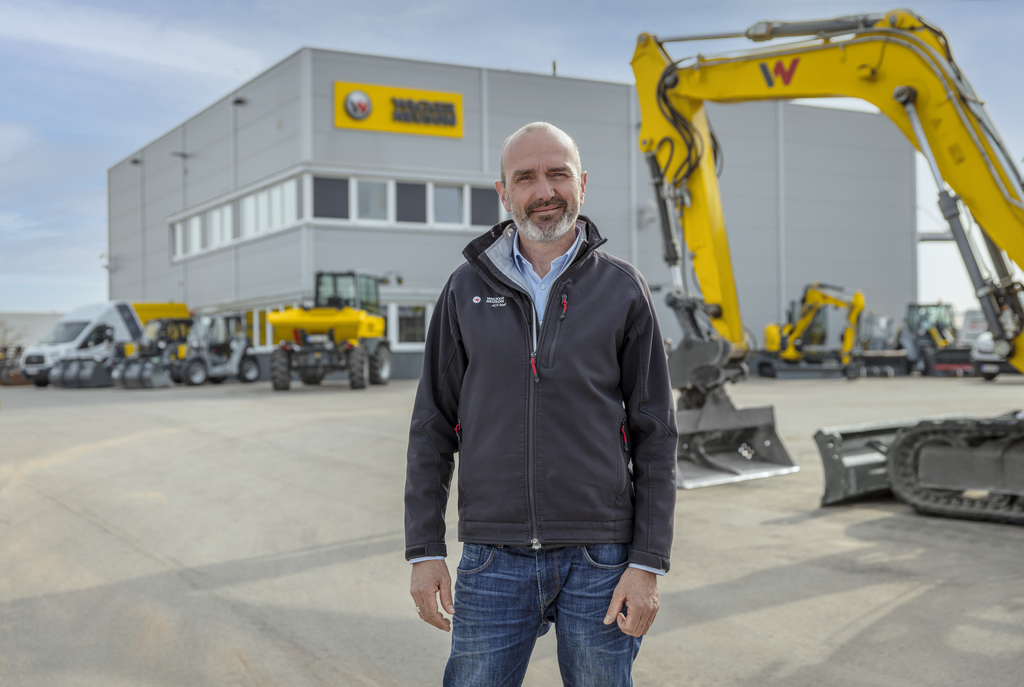 Wacker Neuson employee standing in front of Wacker Neuson rental station.