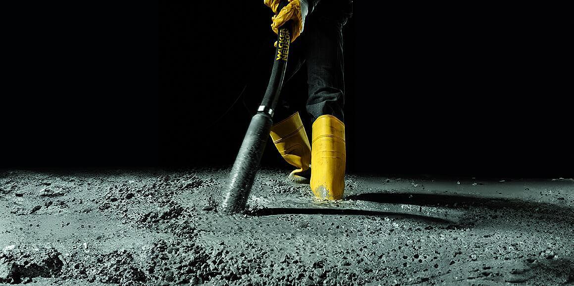 concrete consolidation with an internal vibrator in action