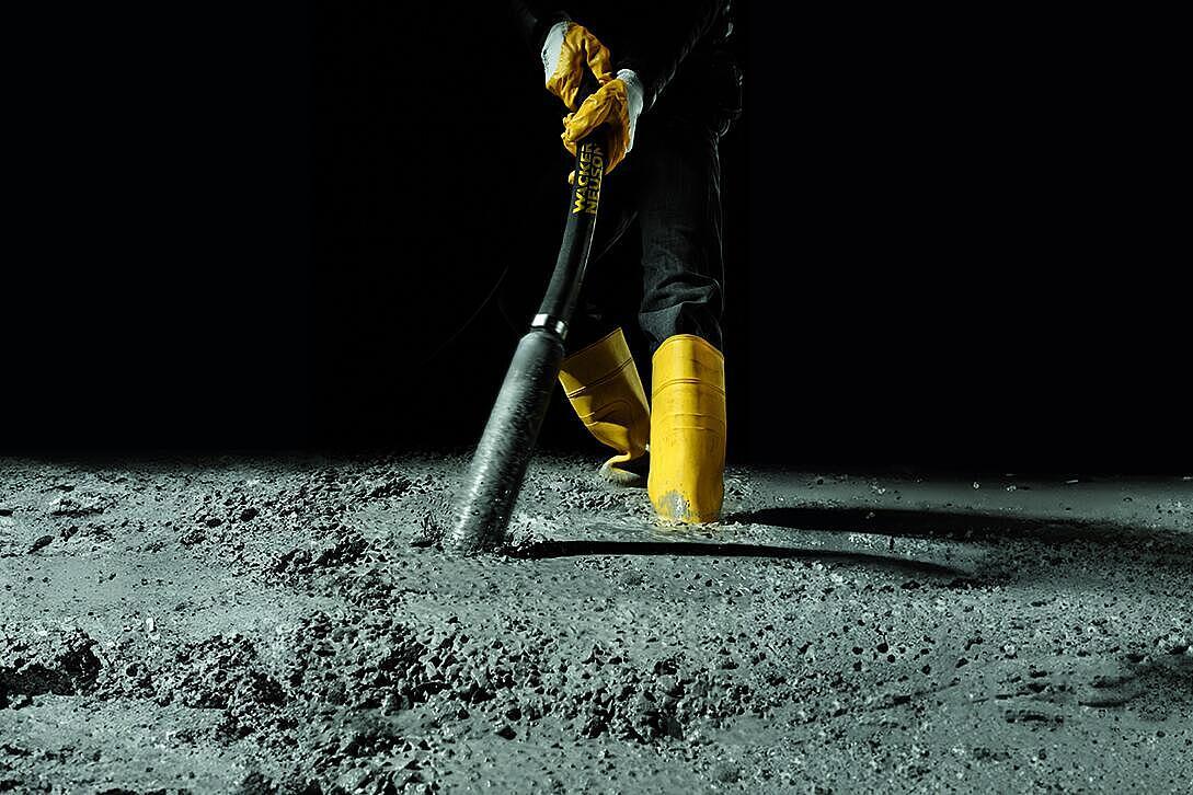 concrete consolidation with an internal vibrator in action