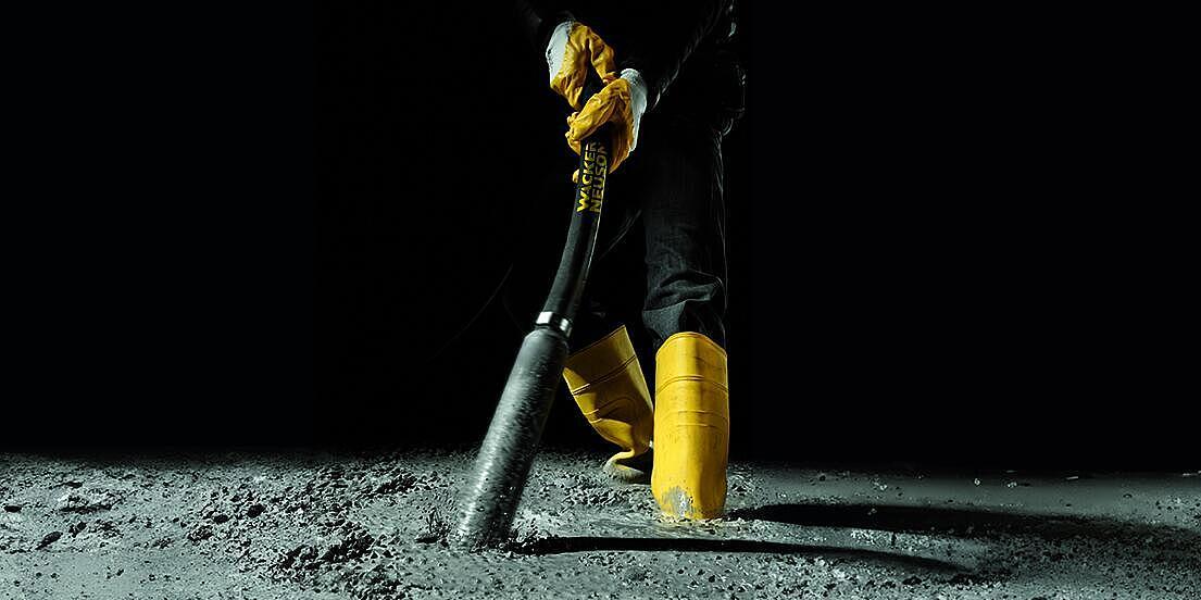 concrete consolidation with an internal vibrator in action