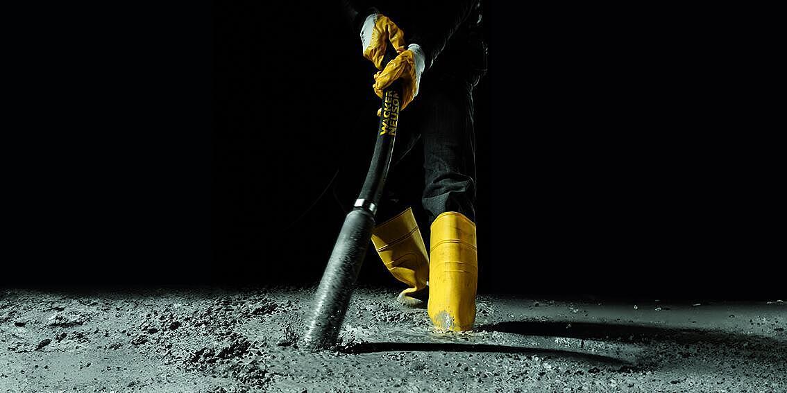 concrete consolidation with an internal vibrator in action