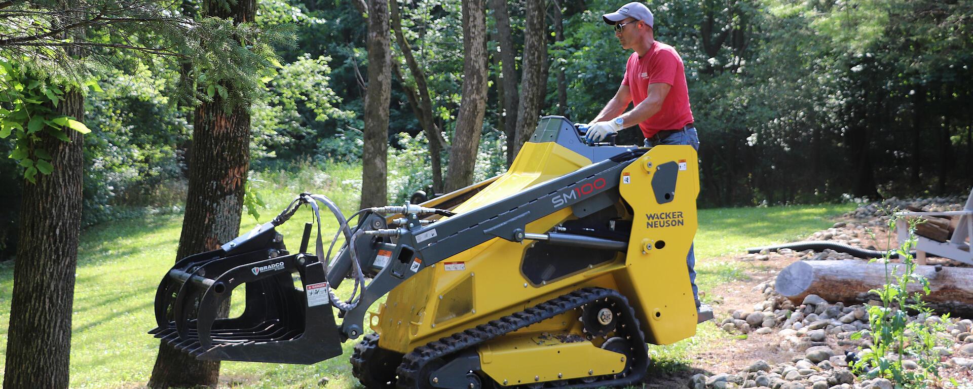 SM100 Utility Track Loader