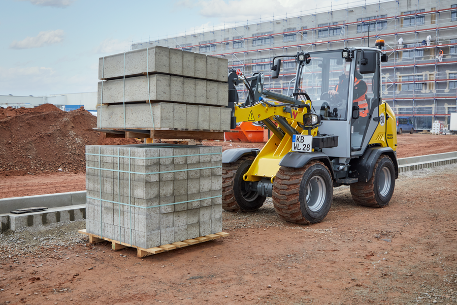 Wacker Neuson wheel loader WL28, cabin, action picture with pallet fork