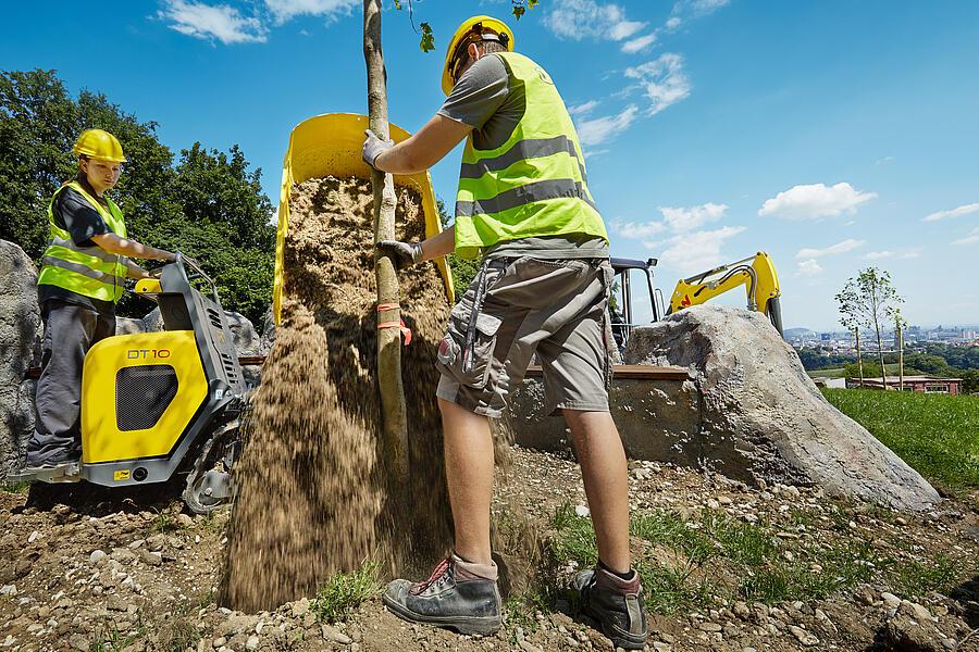 DT10 when unloading soil with the help of the turn-tip skip in horticulture