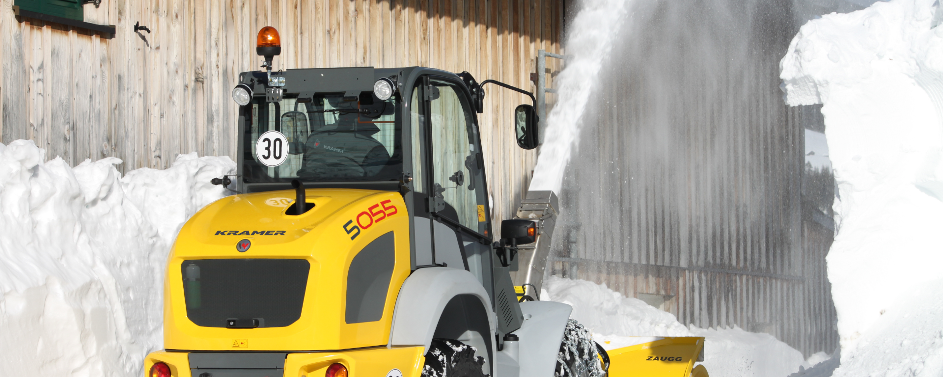 The Kramer wheel loader 5050 while using a snow blower.