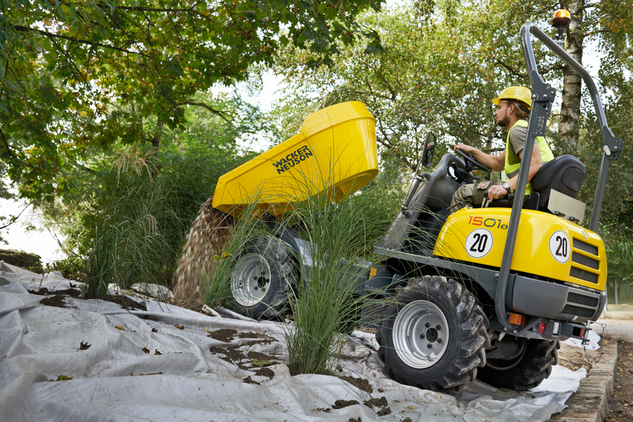 1501s wheel dumper tips stones onto a weed tile when redesigning a garden area