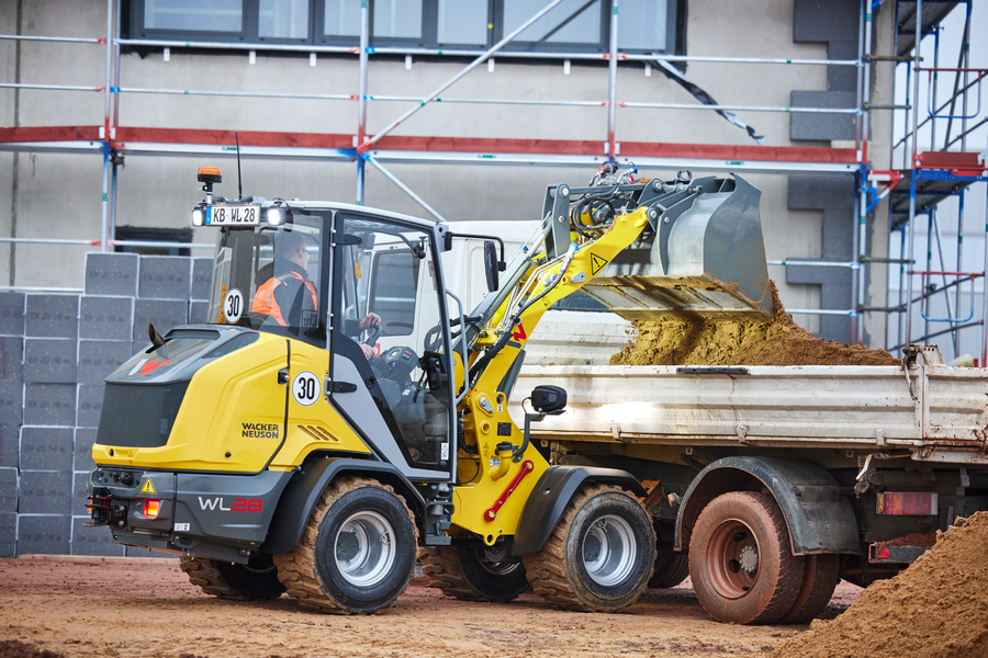 Wacker Neuson wheel loader WL28, cabin, action picture with earth bucket