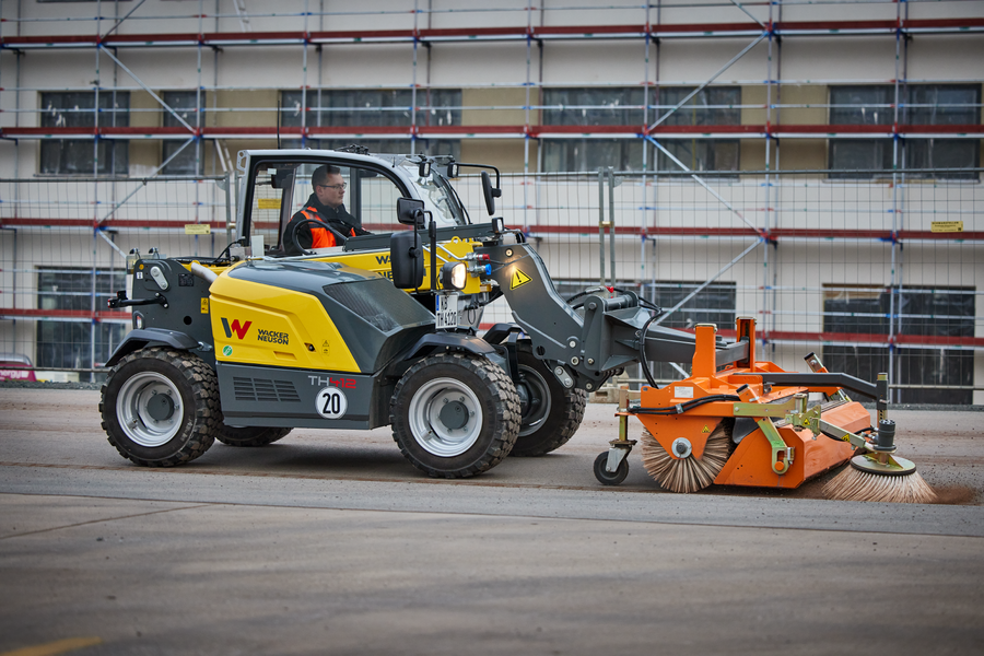 Wacker Neuson telehandler TH412, application picture with sweeping machine