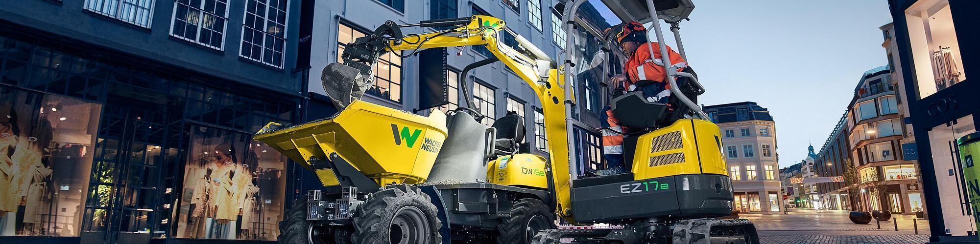 Wacker Neuson zero tail excavator EZ17e in application on a construction site in the city.