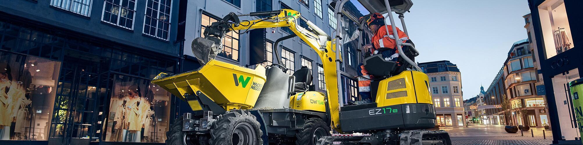 Wacker Neuson zero tail excavator EZ17e in application on a construction site in the city.