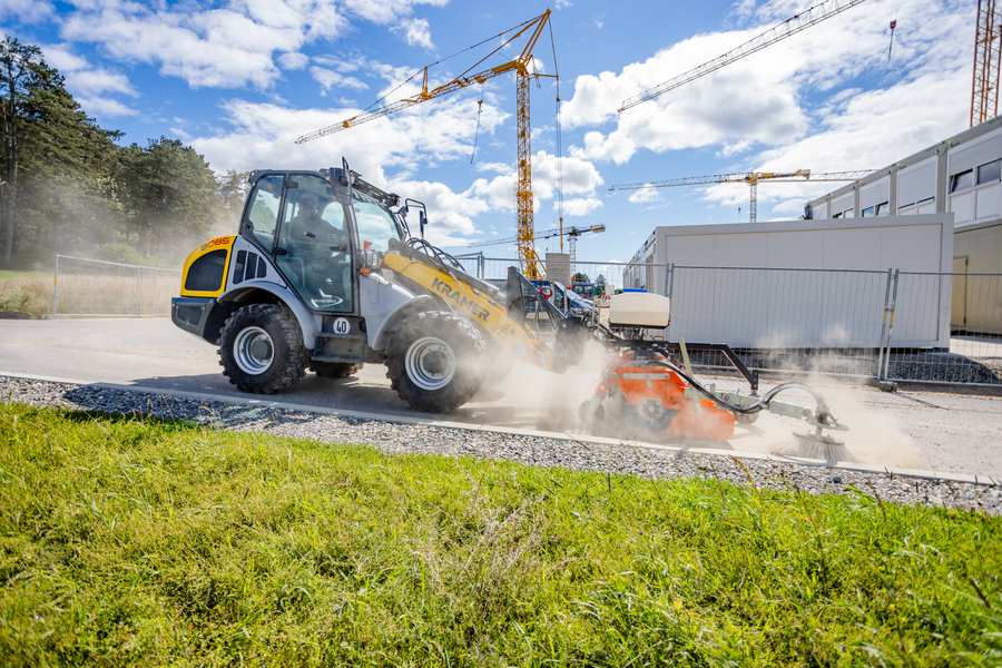 The Kramer wheel loader 8085 while cleaning a street.