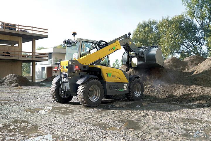 Wacker Neuson telehandler TH412e with earth bucket in application