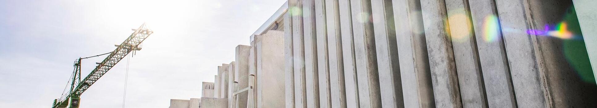 Concrete walls standing vertically on a construction site.