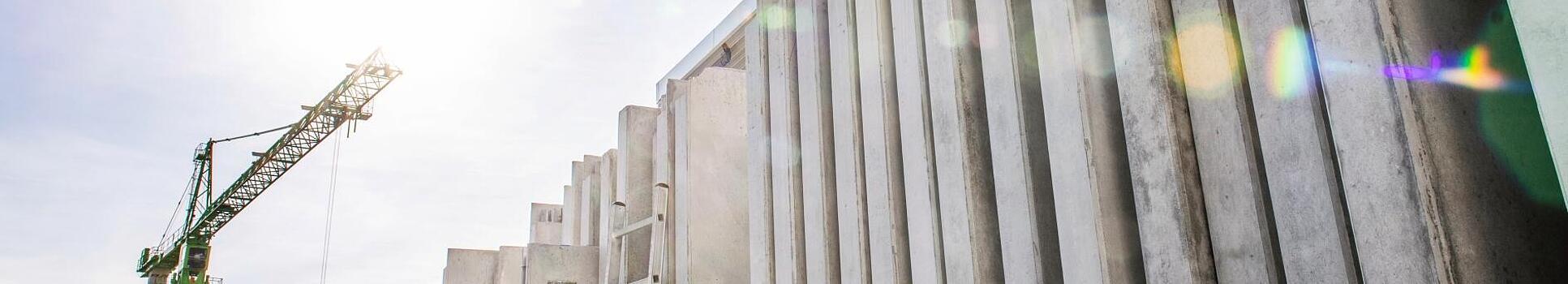 Concrete walls standing vertically on a construction site.