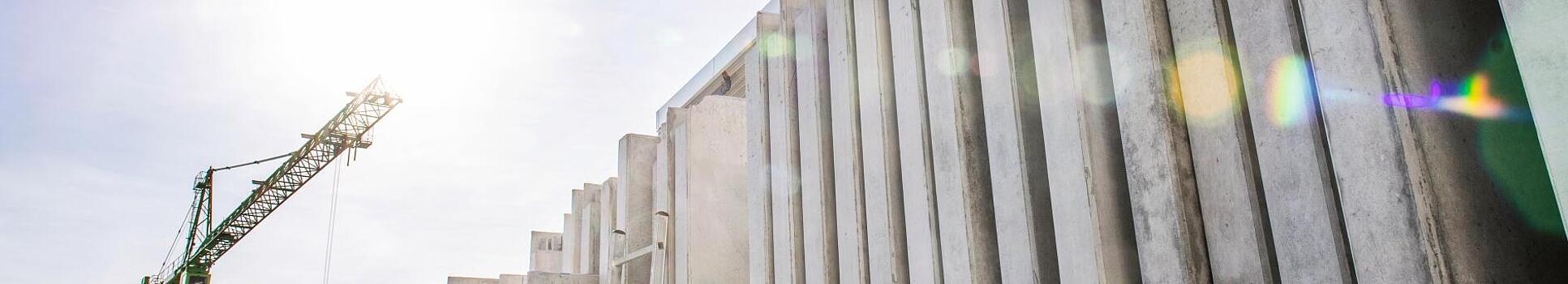 Concrete walls standing vertically on a construction site.