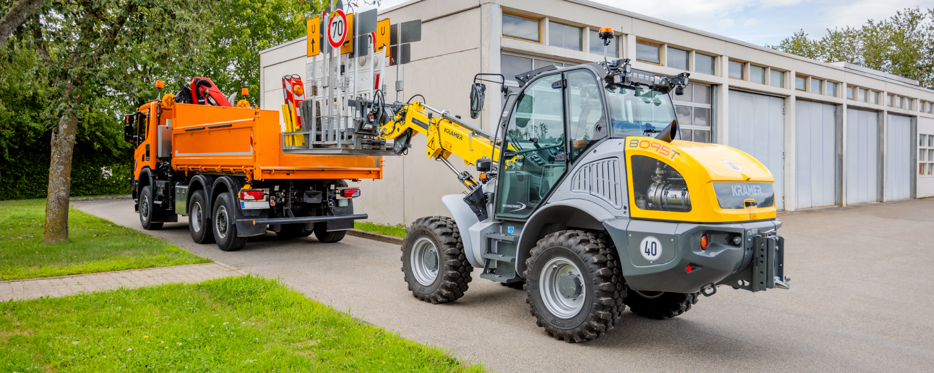 The Kramer telescopic wheel loader 8095T while loading traffic signs.