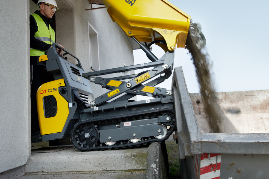 The DT08 can use the high-tip skip to unload rubble material into a container