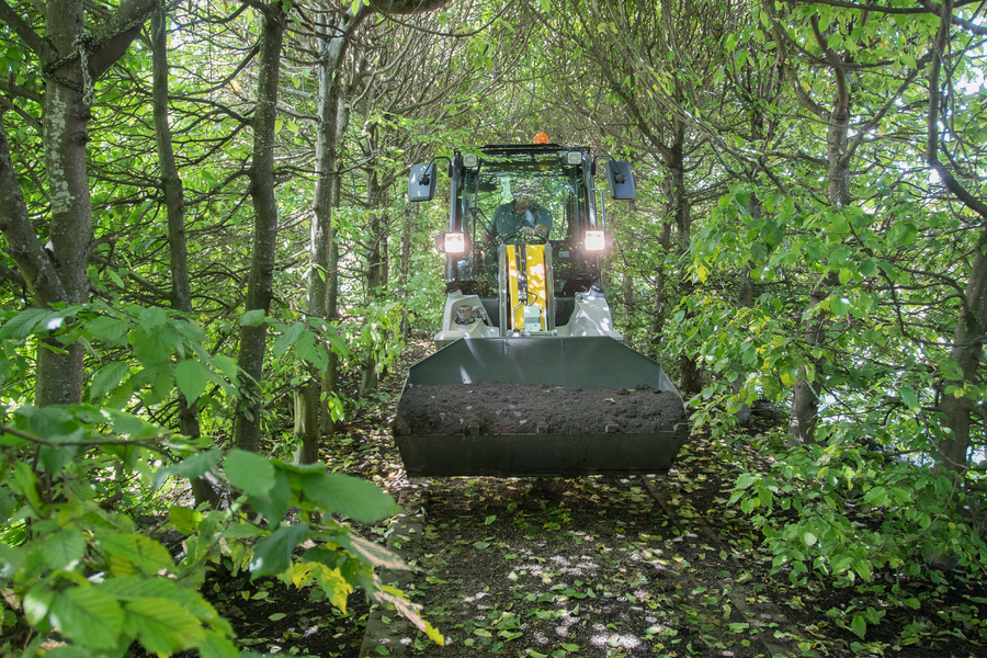 The compact 5035 while transport work in gardening and landscaping.