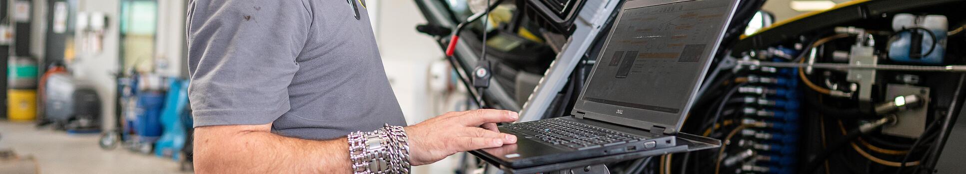 wacker neuson employee checks machine