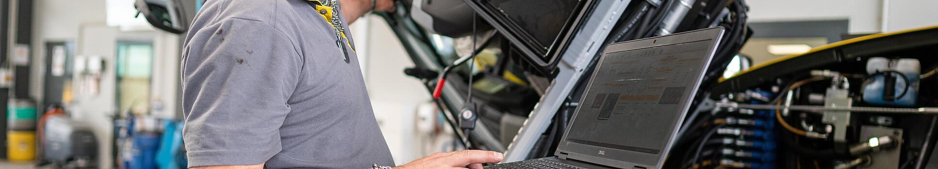 wacker neuson employee checks machine