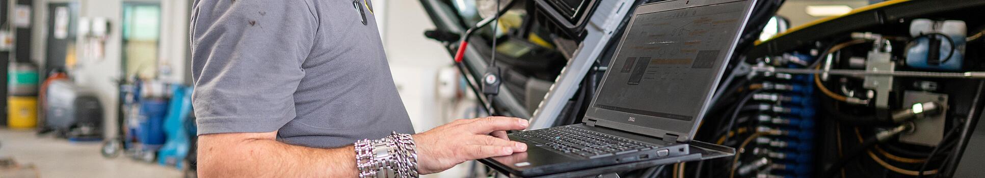 wacker neuson employee checks machine