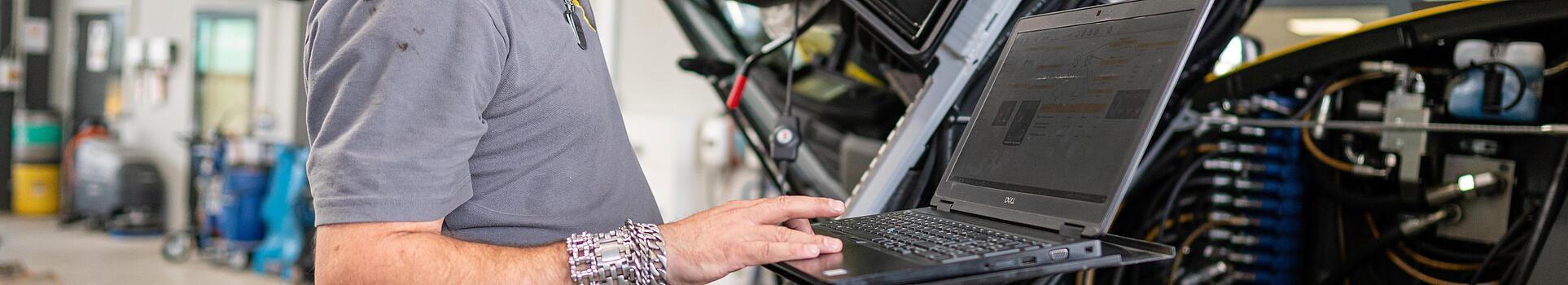 wacker neuson employee checks machine