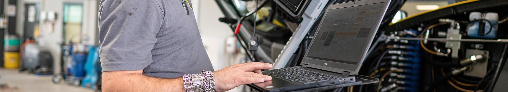 wacker neuson employee checks machine