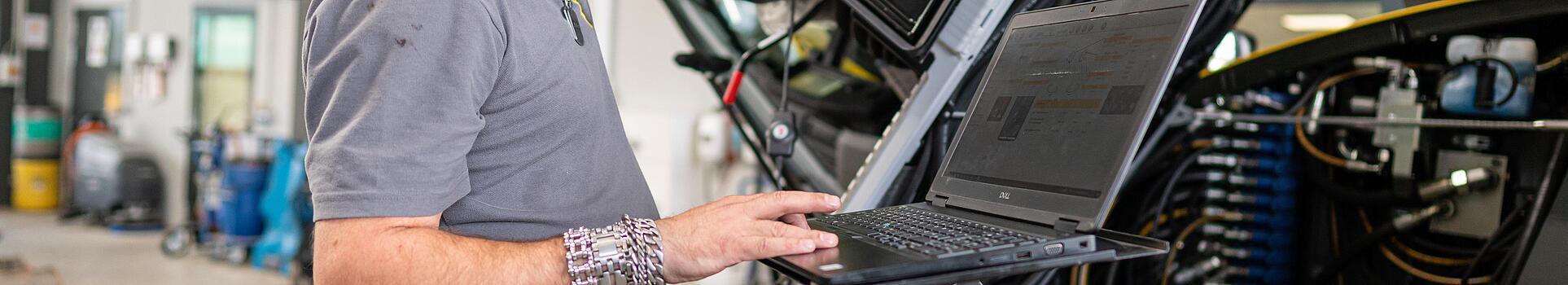 wacker neuson employee checks machine