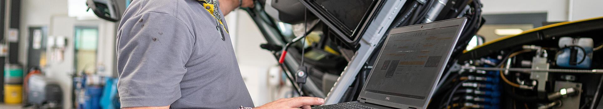 wacker neuson employee checks machine