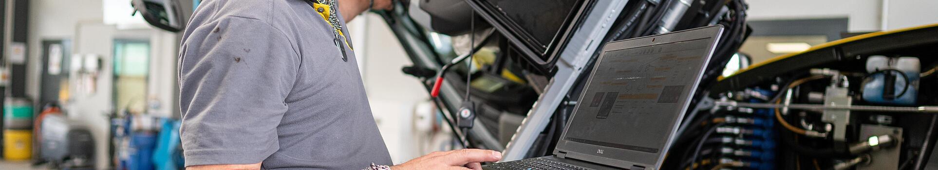 wacker neuson employee checks machine