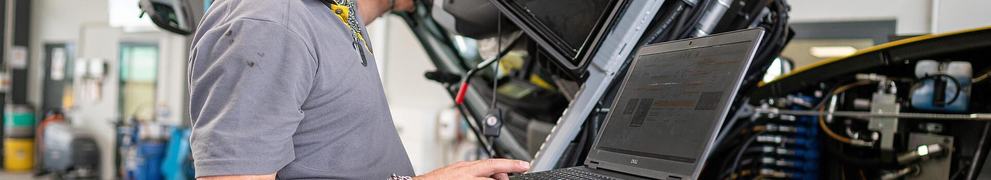 wacker neuson employee checks machine