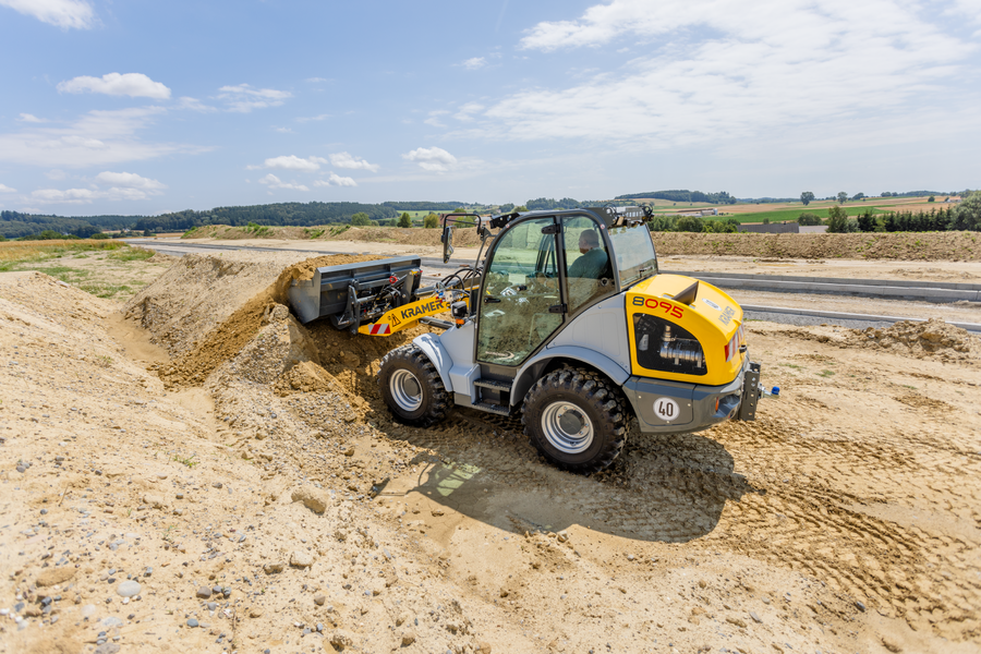 The Kramer wheel loader 8095 while working with soil.