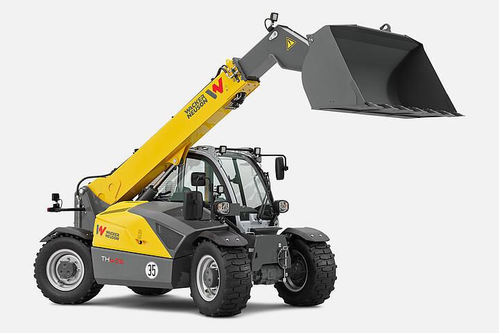 Телескопический погрузчик Wacker Neuson TH625 в студии, функция автоматического возврата лопаты, функция вибрации