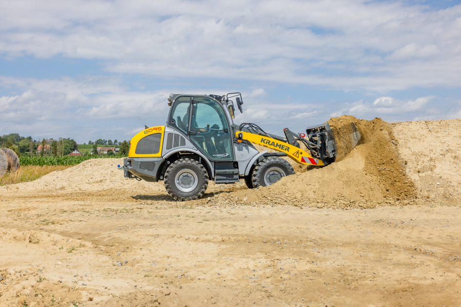 The Kramer wheel loader 8095 while working with soil.