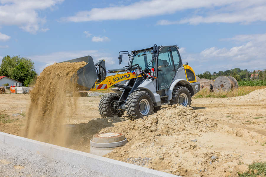 The Kramer wheel loader 8095 while working with soil.