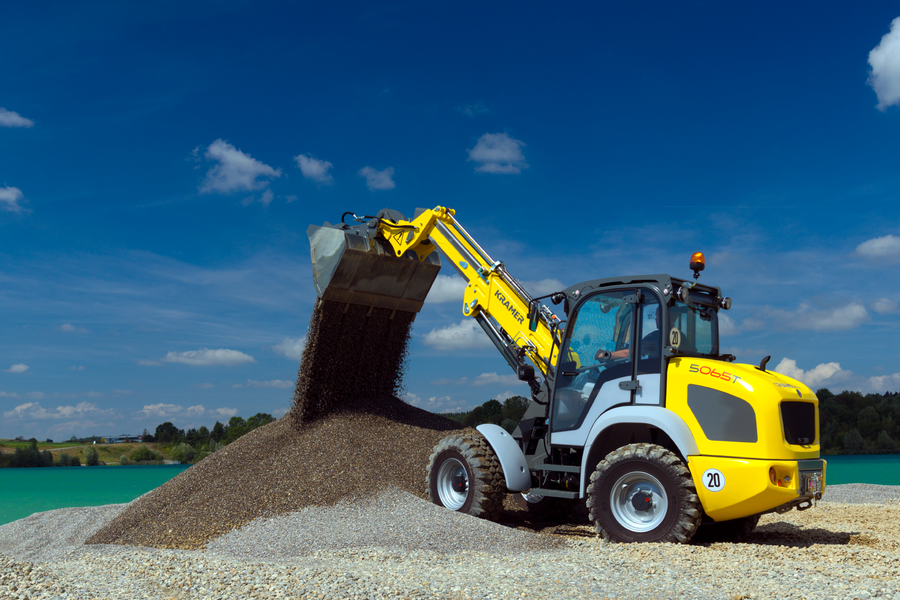 The Kramer telescopic wheel loader 5065T while loading soil.